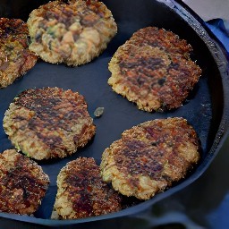 flipping the veggie patties with a fish slice and cooking for 3 more minutes.