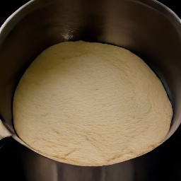 a pot of dough that has been baked for 30 minutes with a lid, then taken out and had the lid removed, and finally put back in the oven for an additional 30 minutes.