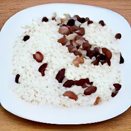 a plate of white rice with kidney beans, paprika, bay leaves, salt and black pepper.