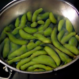 8 cups of boiling water with edamame cooked in it.