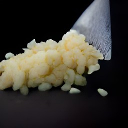 two cloves of garlic that are peeled and minced.