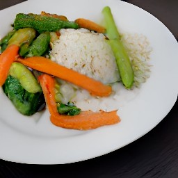 a plate of cooked basmati rice with a side of fried veggies with soy sauce.