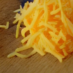 grated parmesan cheese and cheddar cheese.